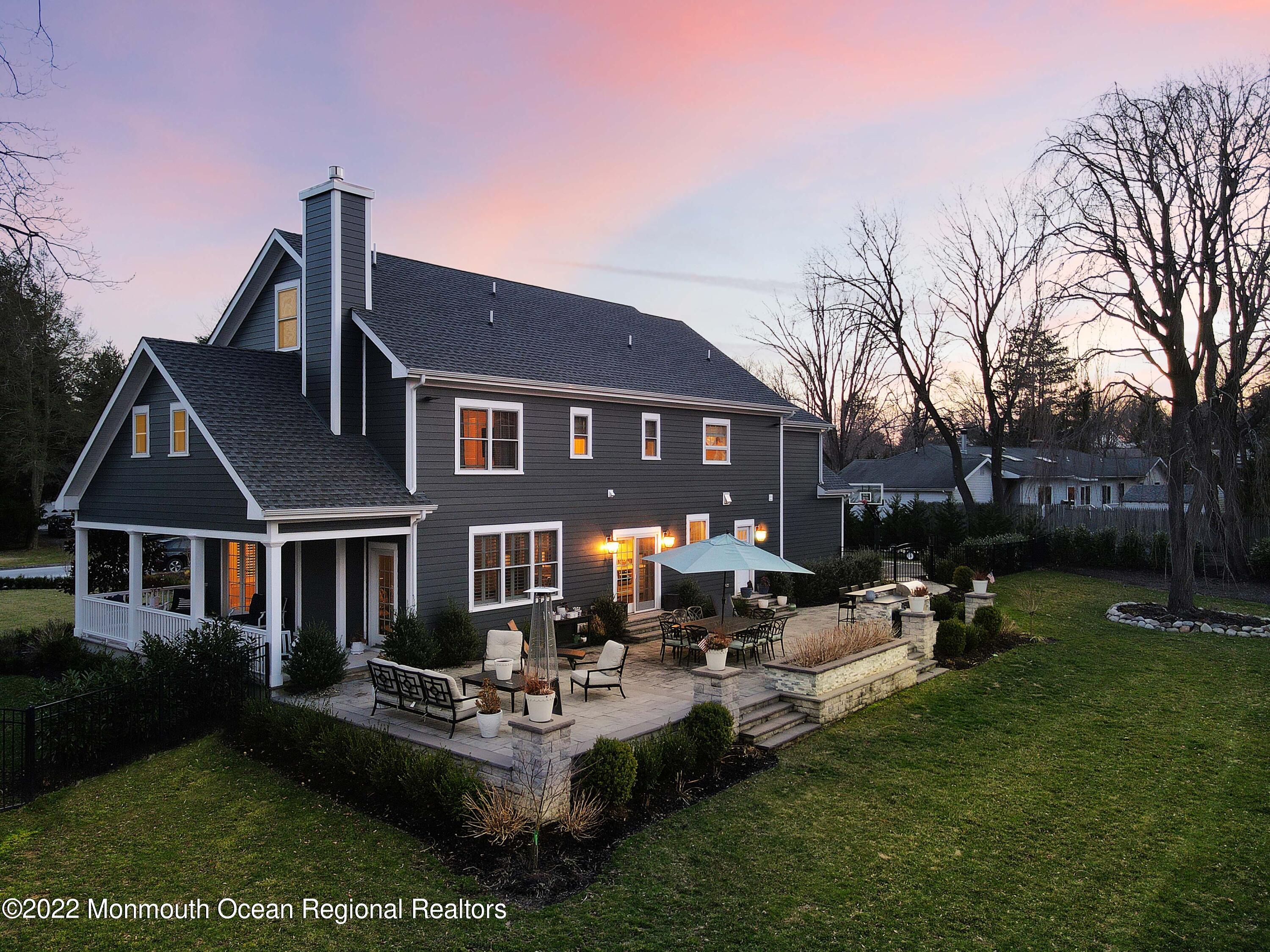 47 Shadowbrook Road Shrewsbury, NJ 07702 - Photo 5 of 39 a front view of a house with garden and sitting area