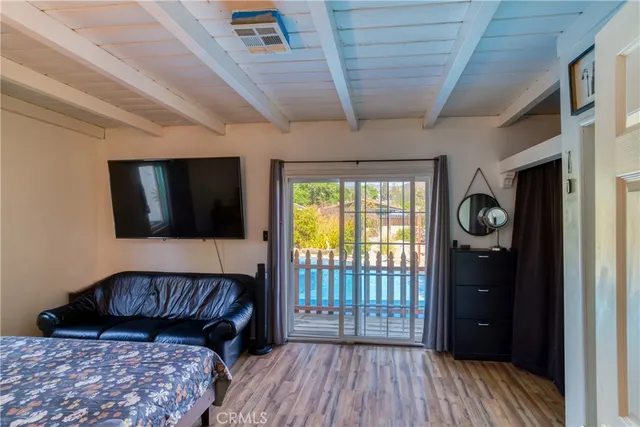 a view of a livingroom with furniture and wooden floor