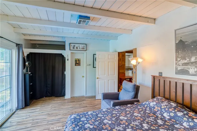 a bedroom with furniture and a rug