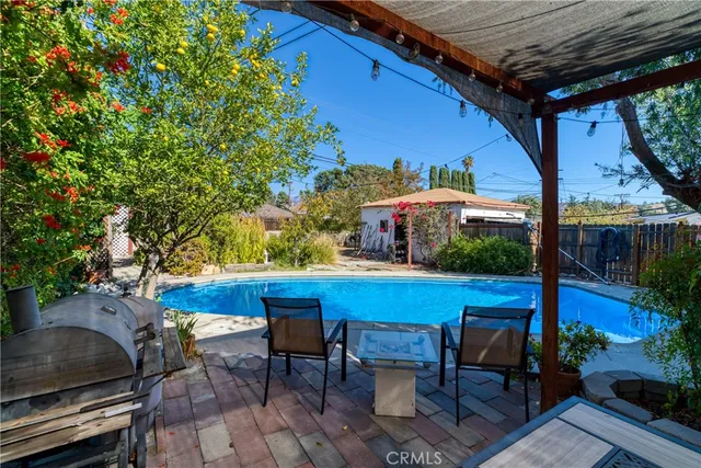 a view of a chairs and table in the patio