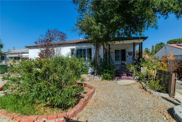 front view of a house with a small yard