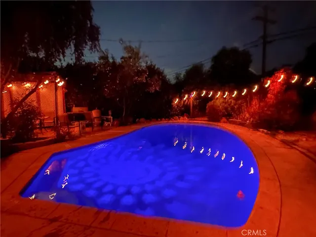 a view of swimming pool outdoor seating