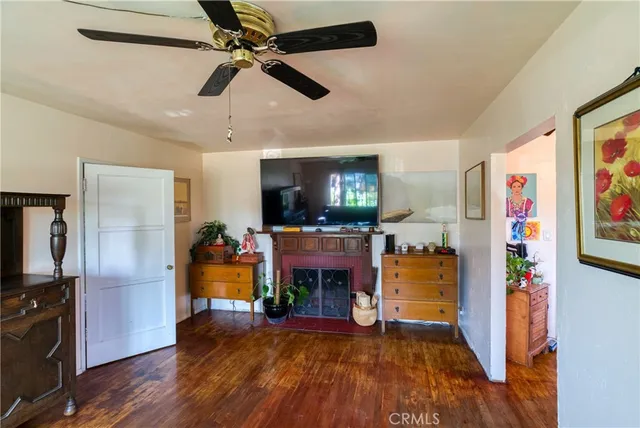 a view of an entryway with wooden floor