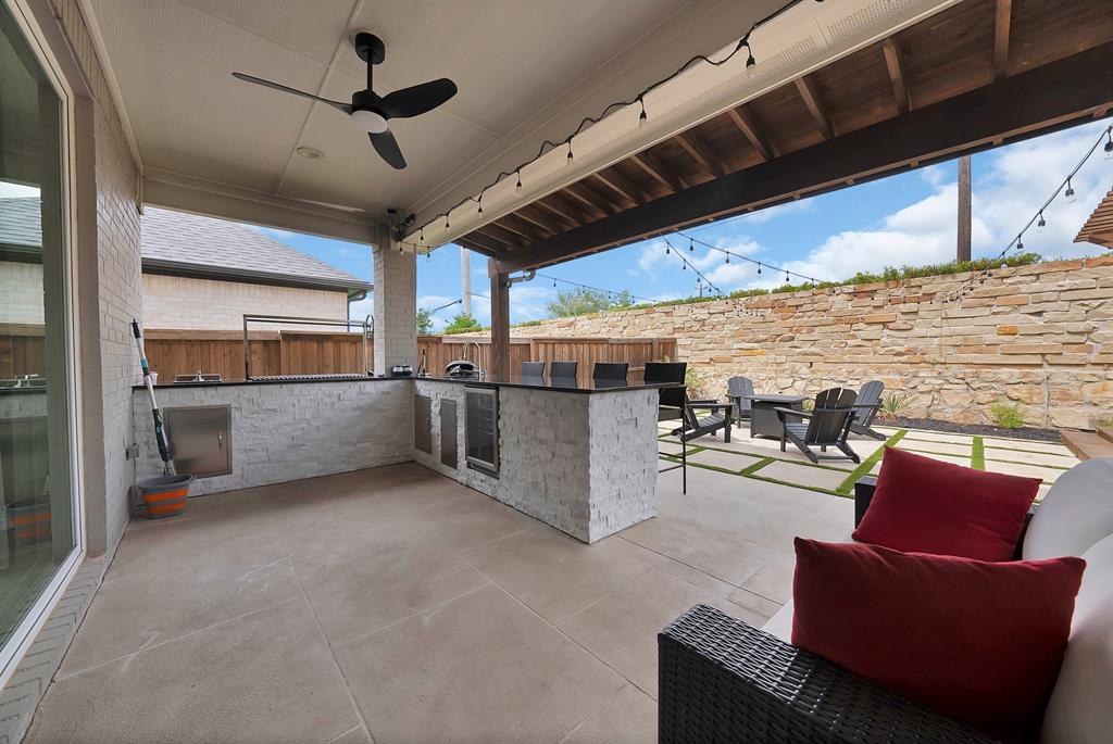 1010 Adair Road Prosper, TX 75078 - Photo 28 of 39 a view of a livingroom with furniture and a kitchen
