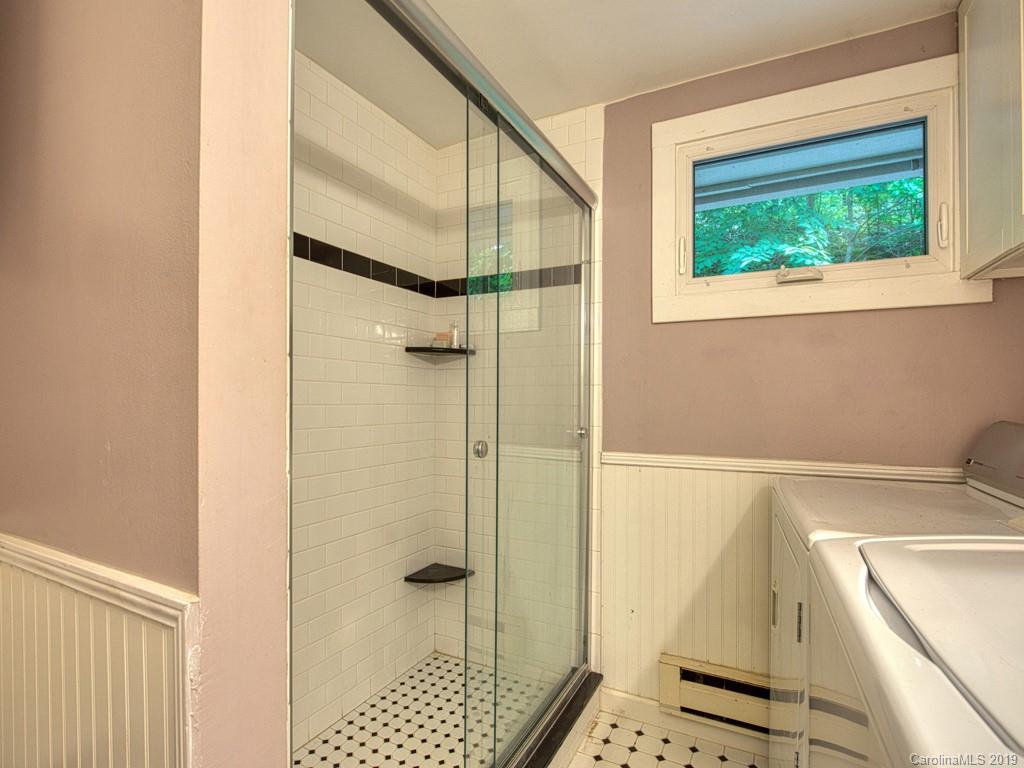 276 Hideaway Creek Road Clyde, NC 28721 - Photo 22 of 32 a bathroom with a shower