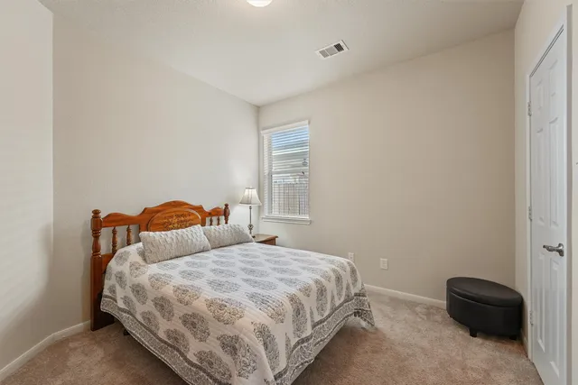 a view of small space with table and a mirror