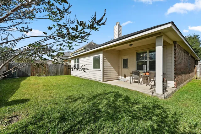 a patio with table and chairs