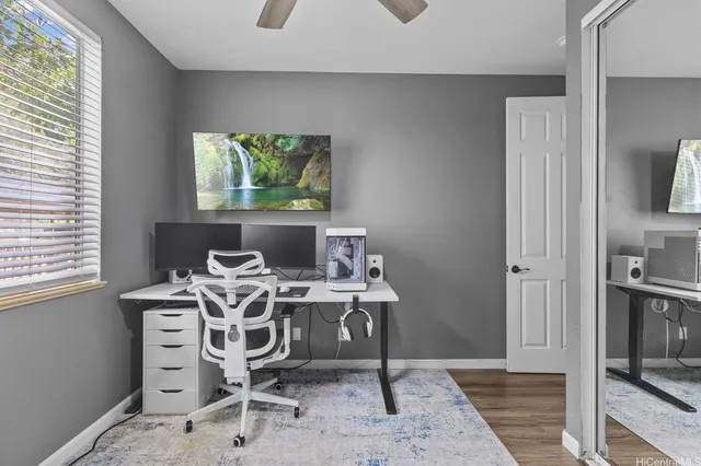 a workspace with furniture and window