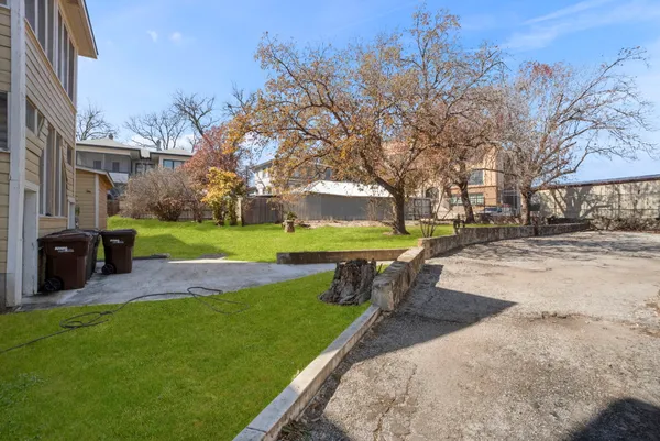 a view of a park with iron fence