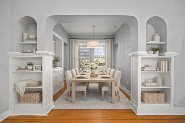 a dining room with furniture and window