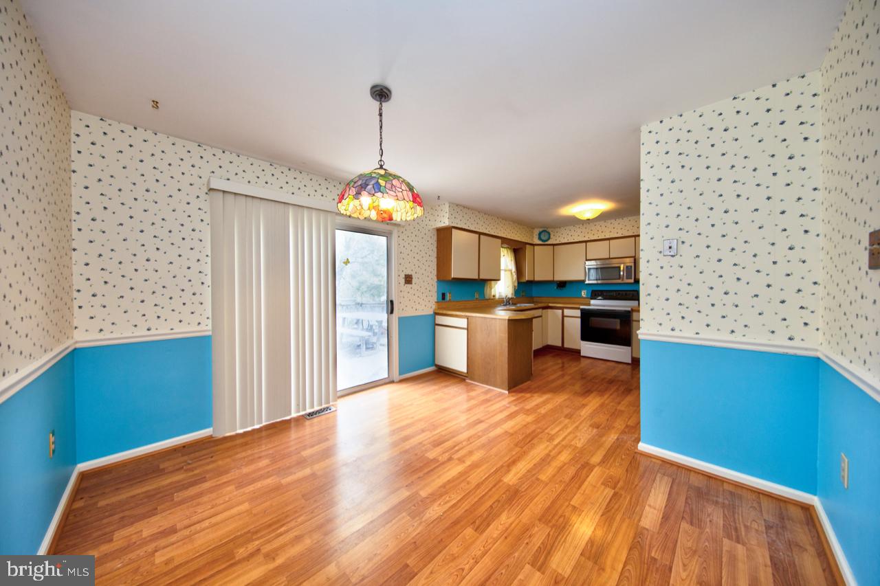 2301 Maple Road Baltimore, MD 21219 - Photo 11 of 28 Large country kitchen w/ sliders leading to deck
