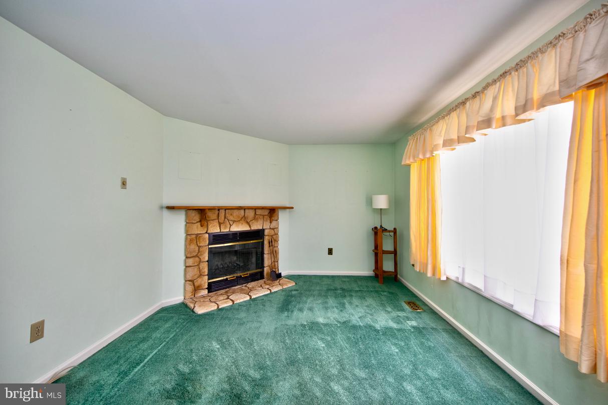 2301 Maple Road Baltimore, MD 21219 - Photo 8 of 28 Living room with wood burning fireplace