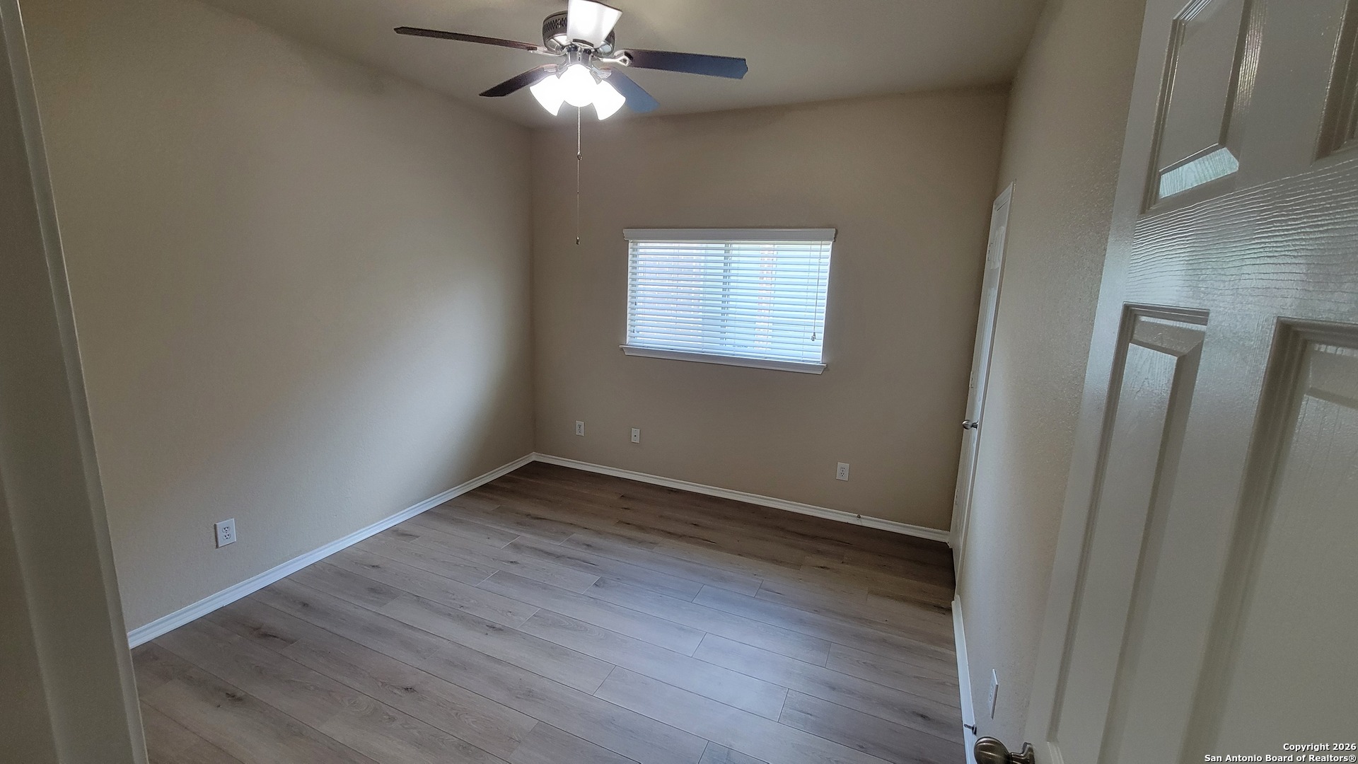 26311 Presidio Boerne, TX 78015 - Photo 13 of 16 an empty room with wooden floor fan and windows