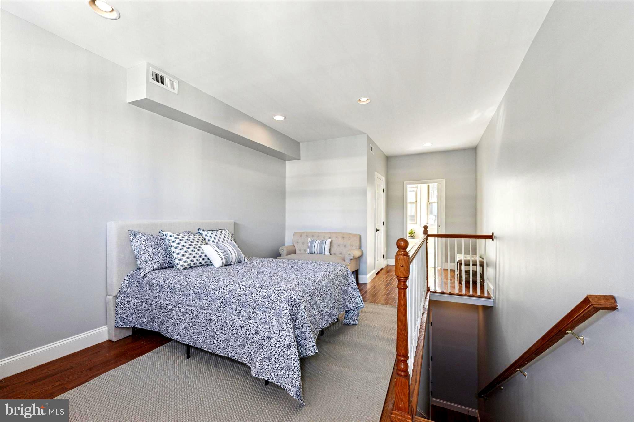 2231 League Street Philadelphia, PA 19146 - Photo 11 of 23 a bedroom with a bed and wooden floor