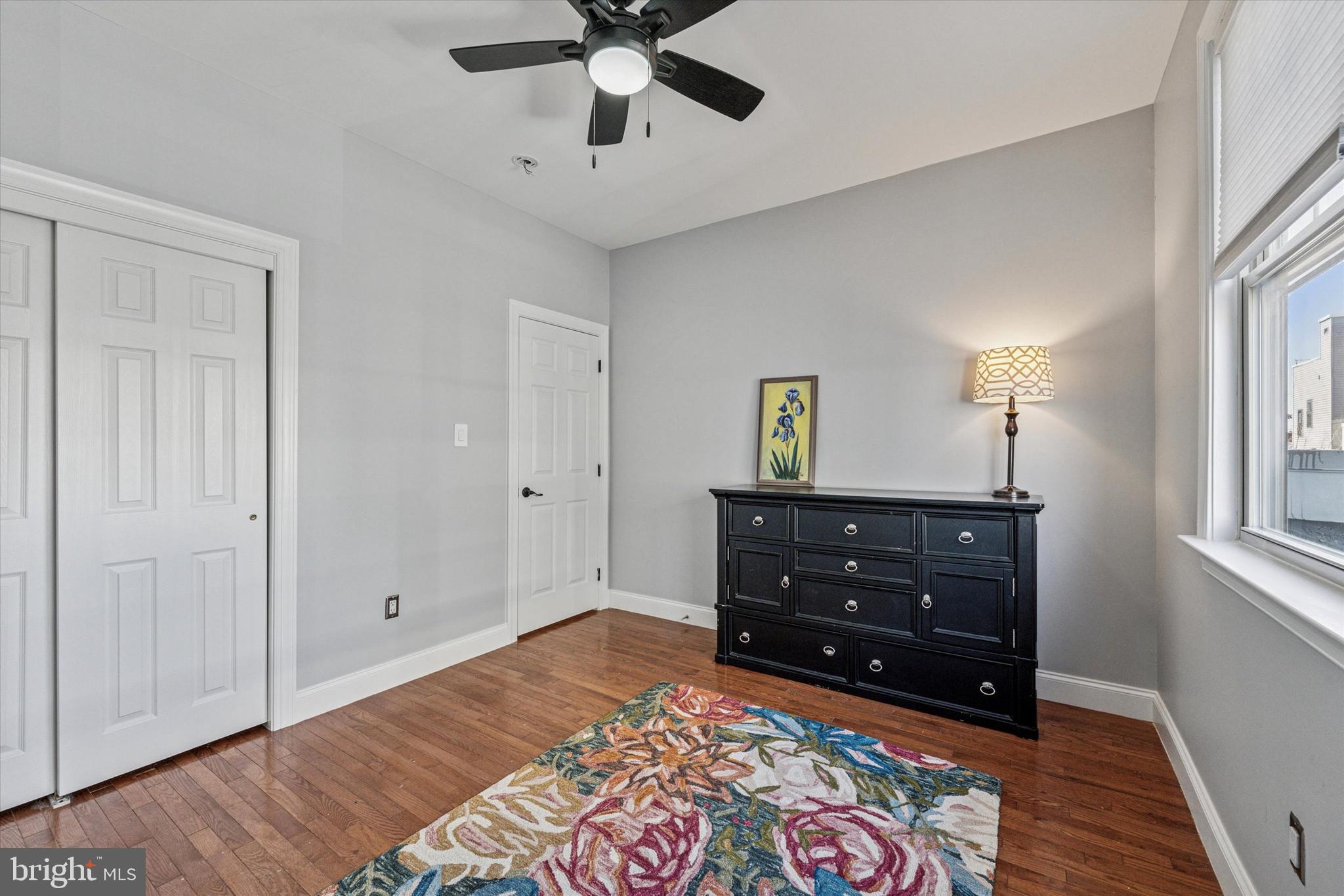 2231 League Street Philadelphia, PA 19146 - Photo 13 of 23 a bedroom with a bed and a chandelier