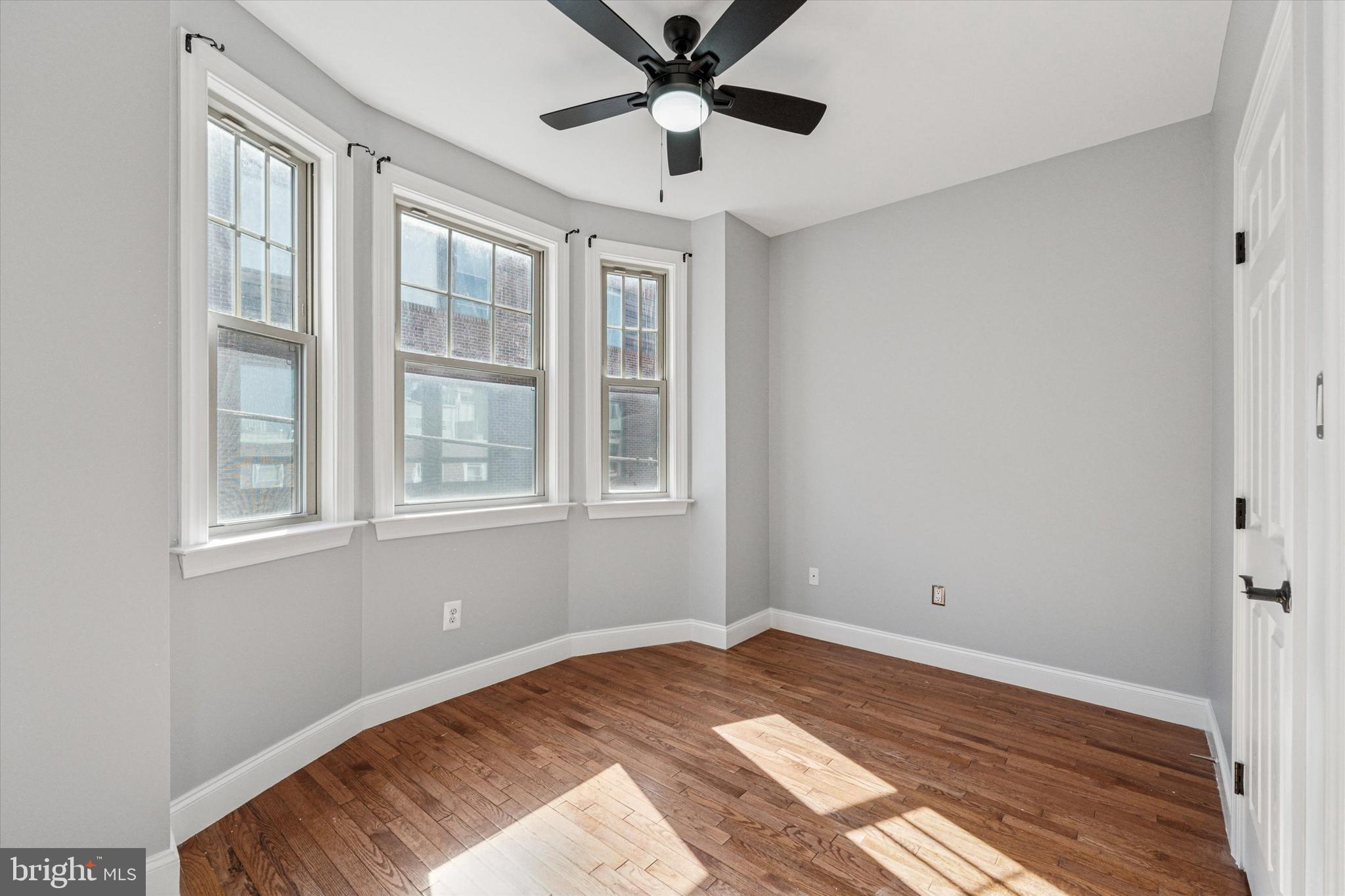 2231 League Street Philadelphia, PA 19146 - Photo 14 of 23 a view of a bedroom with wooden floor and windows