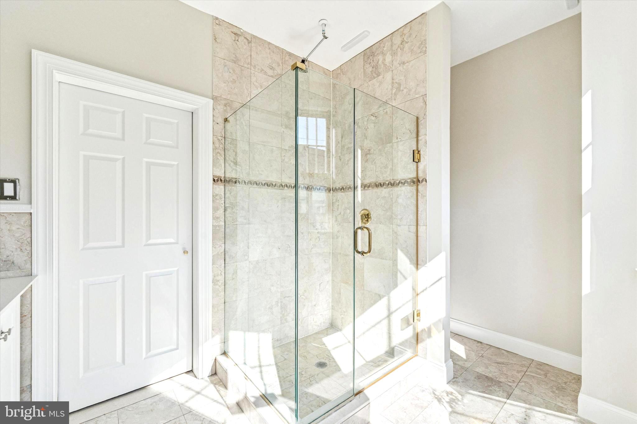 2231 League Street Philadelphia, PA 19146 - Photo 17 of 23 a view of a bathroom with a shower and a window