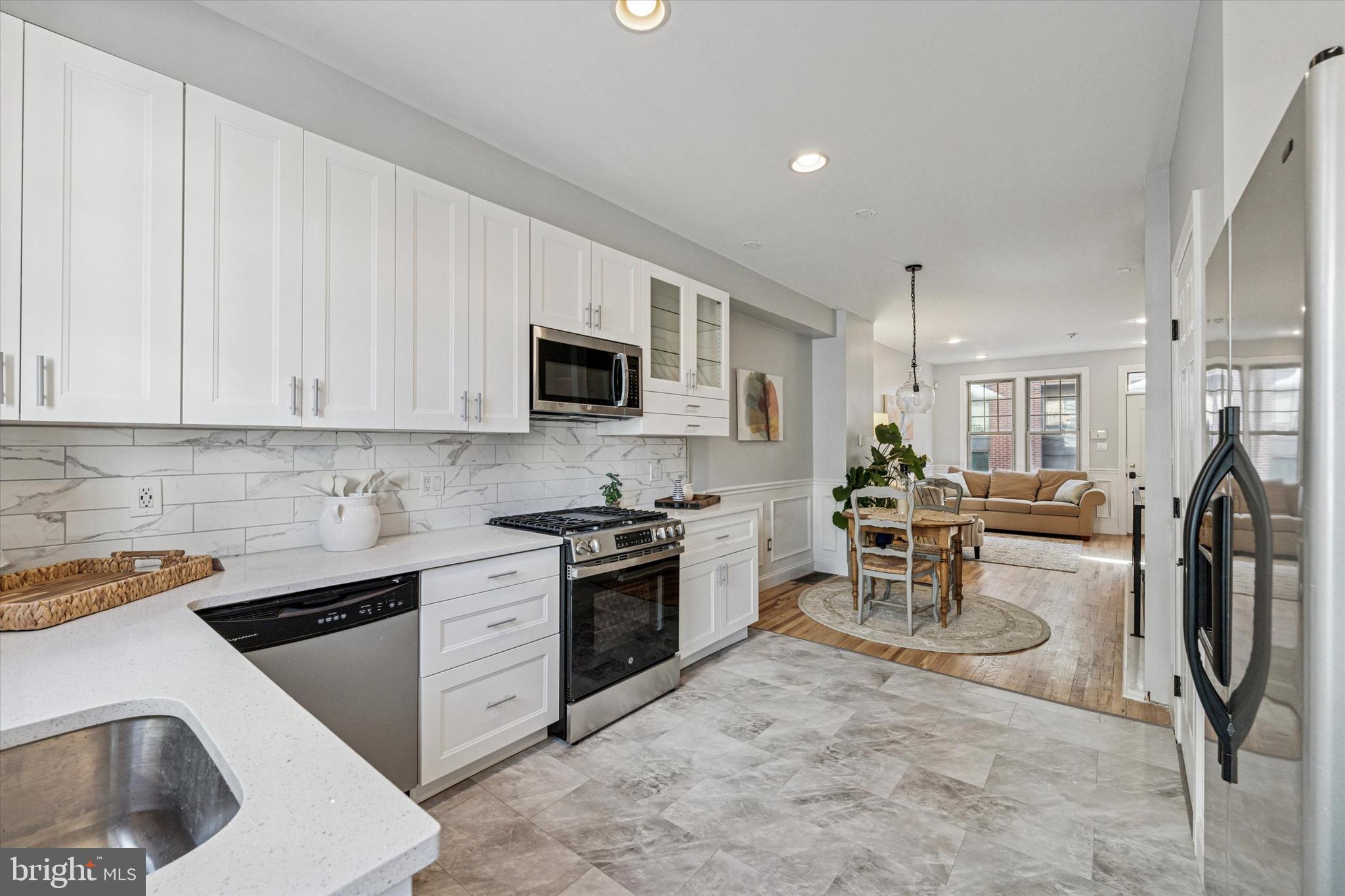 2231 League Street Philadelphia, PA 19146 - Photo 4 of 23 a kitchen with appliances a sink and cabinets