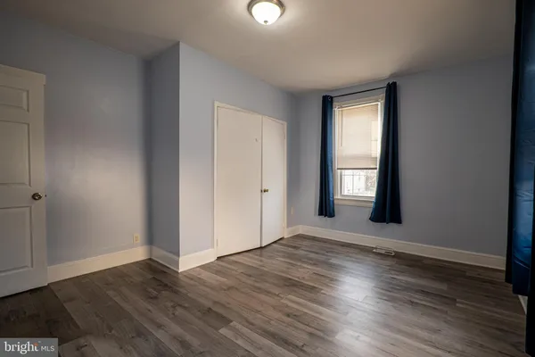 a kitchen with granite countertop a stove and cabinets
