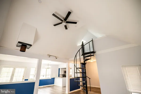 a kitchen with stainless steel appliances granite countertop a refrigerator a stove and a sink