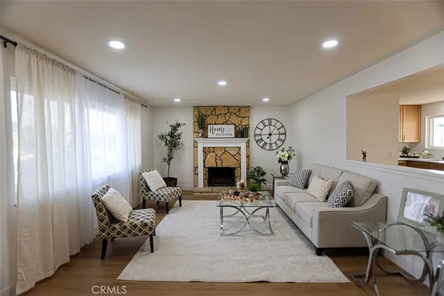 a living room with furniture and a fireplace