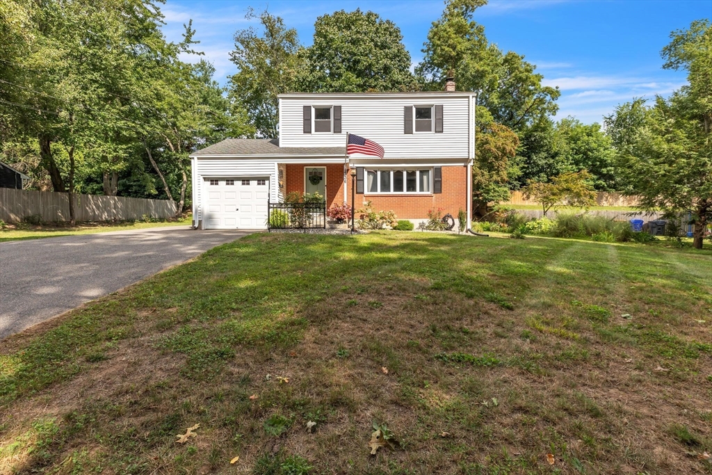 336 Taylor Road Enfield, CT 06082 - Photo 1 of 30 a front view of a house with a garden