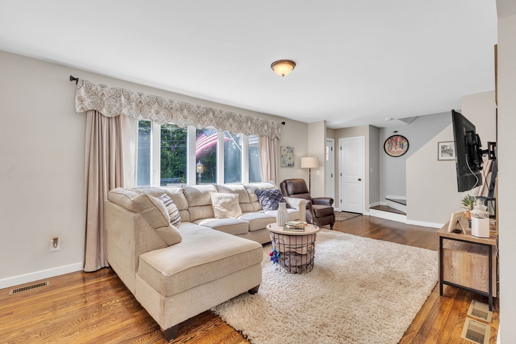 336 Taylor Road Enfield, CT 06082 - Photo 14 of 30 a living room with furniture and a flat screen tv