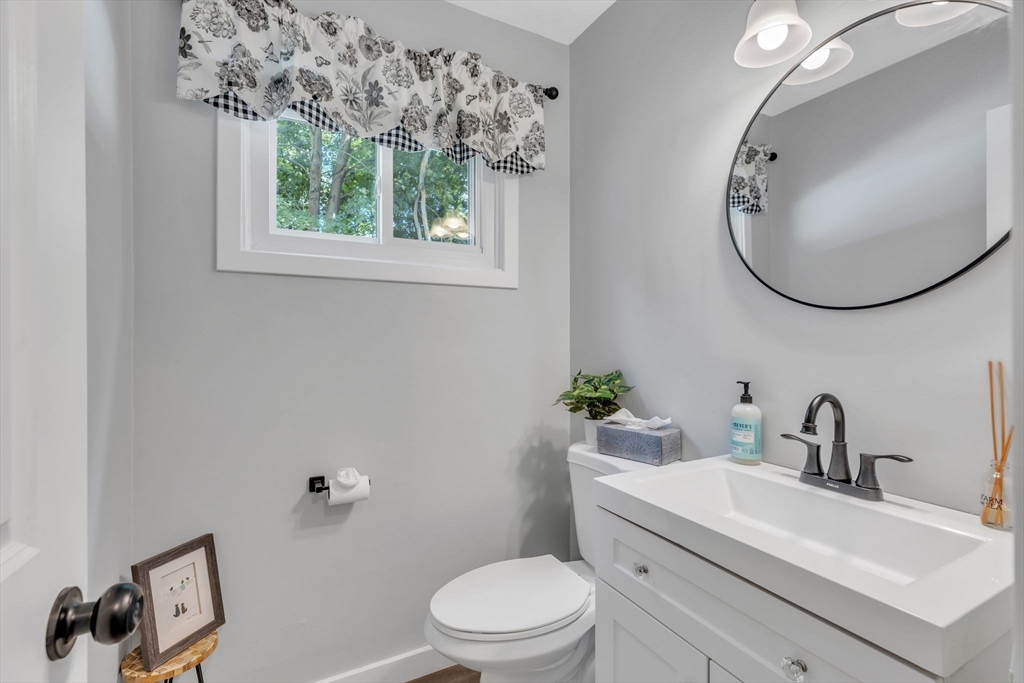 336 Taylor Road Enfield, CT 06082 - Photo 18 of 30 a bathroom with a sink a toilet and a mirror