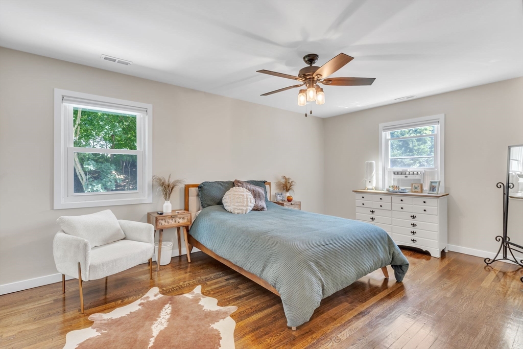 336 Taylor Road Enfield, CT 06082 - Photo 19 of 30 a bedroom with a bed and a chair