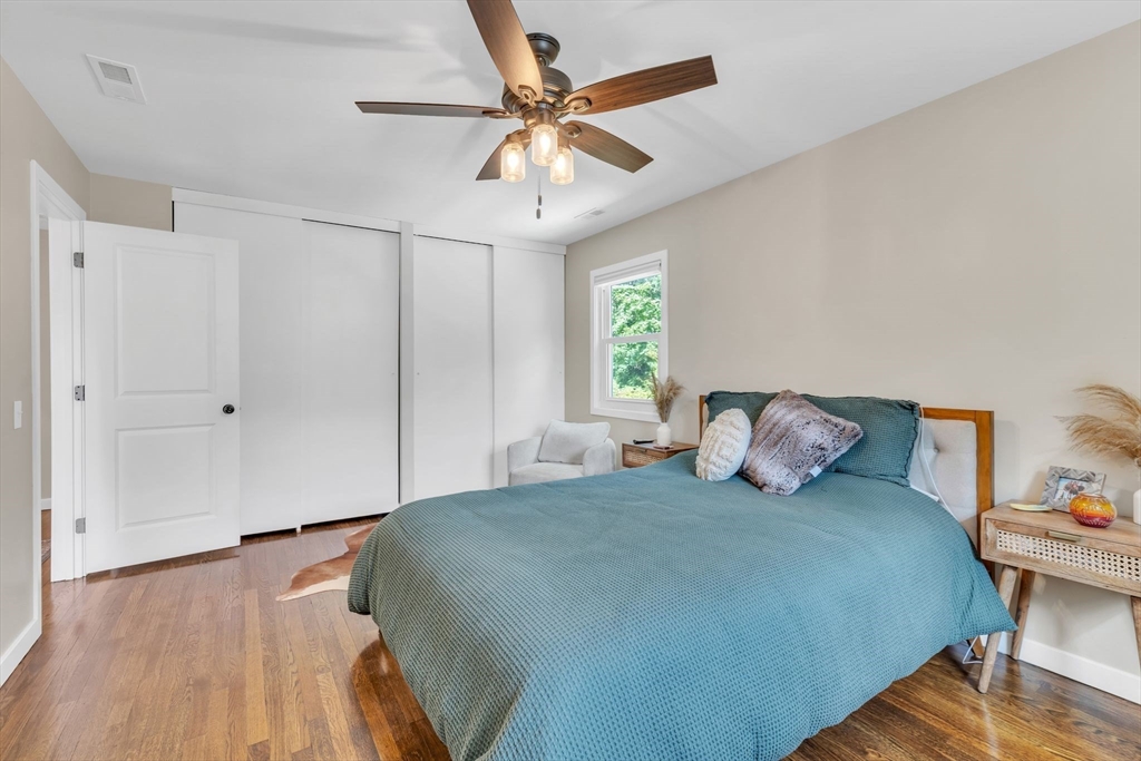 336 Taylor Road Enfield, CT 06082 - Photo 20 of 30 a bedroom with a bed and a ceiling fan