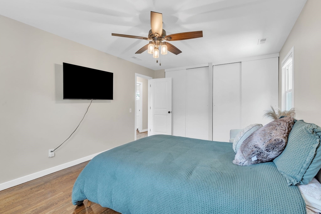 336 Taylor Road Enfield, CT 06082 - Photo 21 of 30 a bedroom with a bed and a flat screen tv