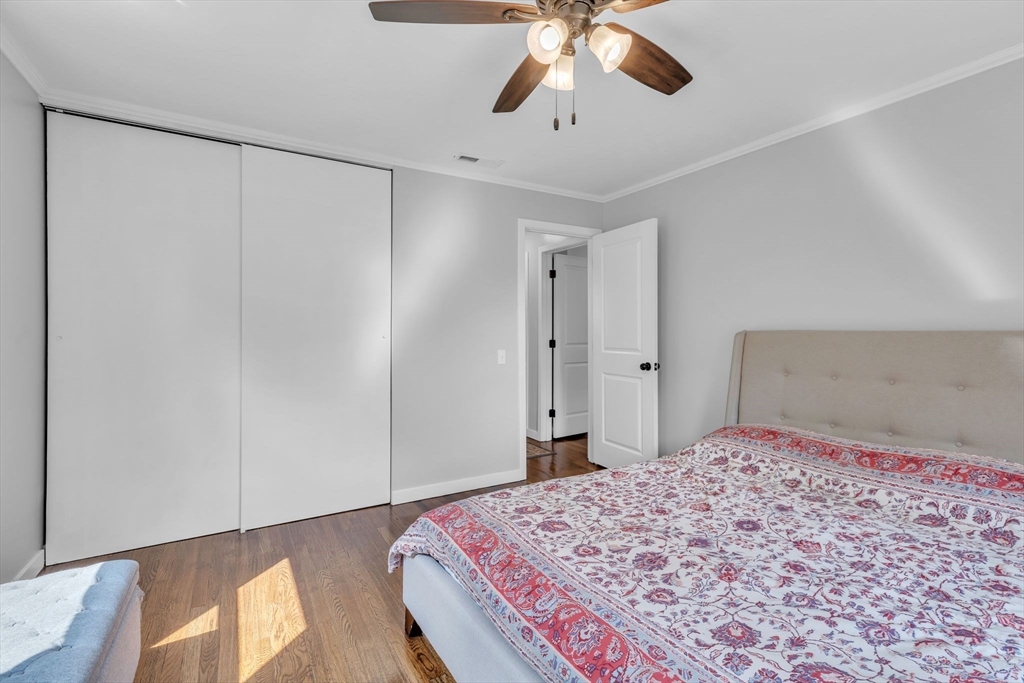 336 Taylor Road Enfield, CT 06082 - Photo 22 of 30 a bedroom with a bed and a chandelier