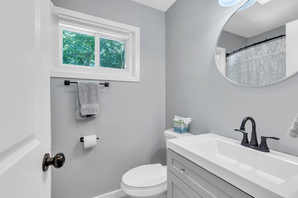 336 Taylor Road Enfield, CT 06082 - Photo 24 of 30 a bathroom with a sink a toilet and a mirror