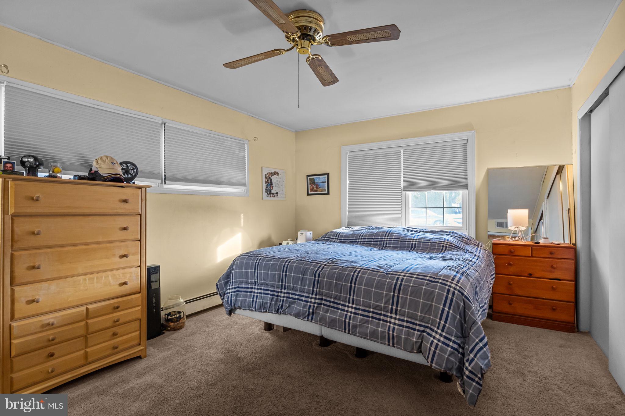 55 Rose Apple Road Levittown, PA 19056 - Photo 20 of 40 a bedroom with a bed and a dresser