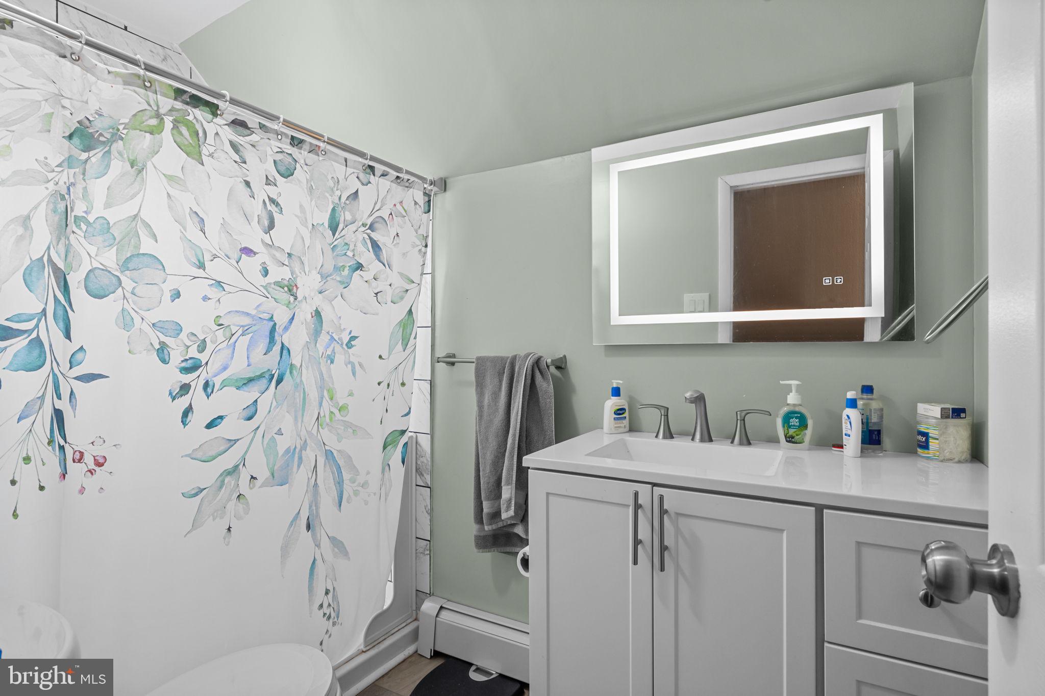 55 Rose Apple Road Levittown, PA 19056 - Photo 26 of 40 a bathroom with a sink toilet and shower