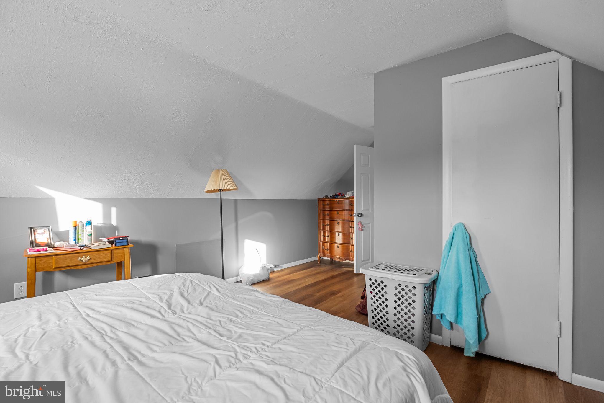 55 Rose Apple Road Levittown, PA 19056 - Photo 31 of 40 a bedroom with a bed and a chandelier