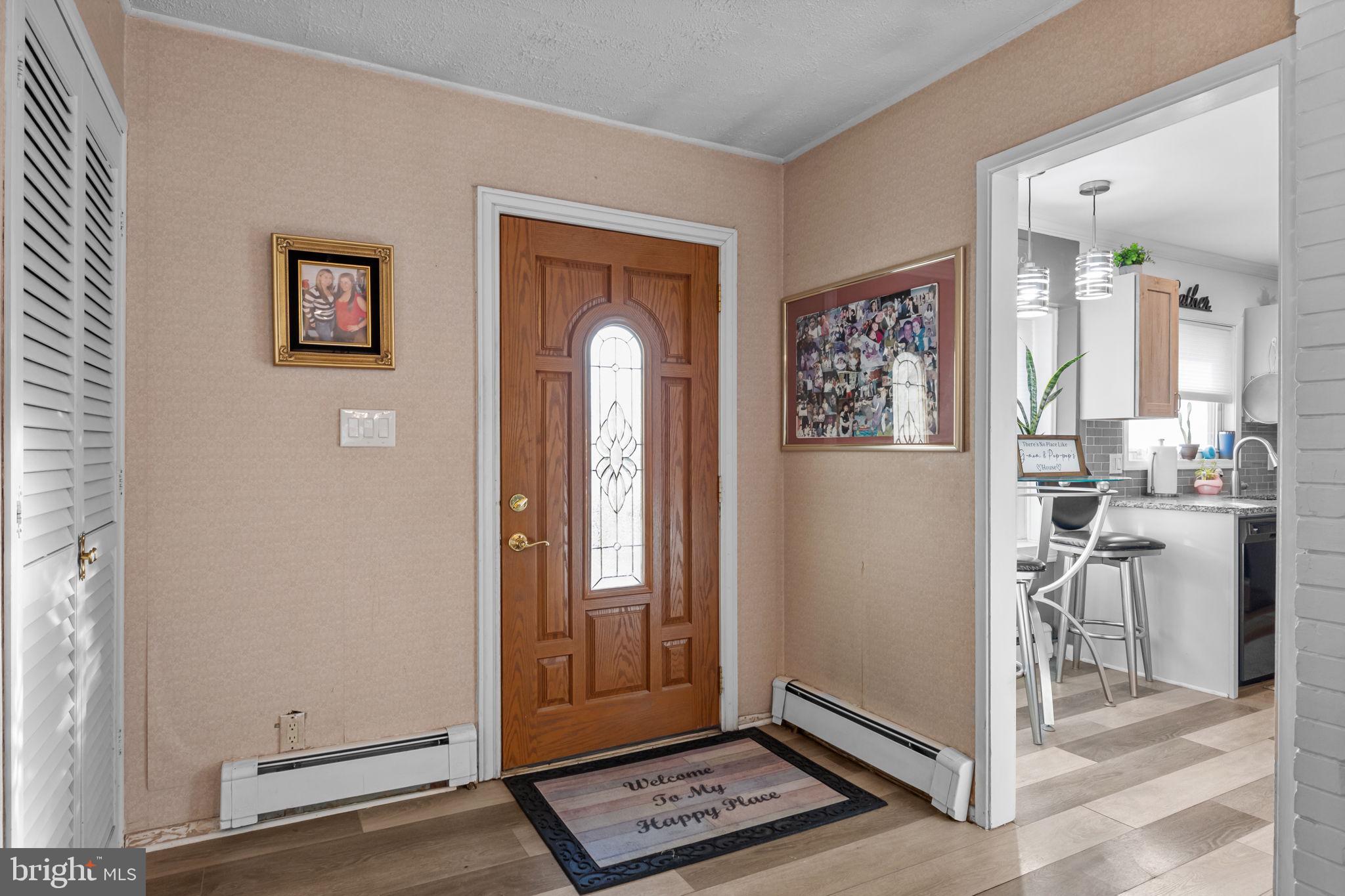 55 Rose Apple Road Levittown, PA 19056 - Photo 5 of 40 a view of a hallway with bathroom view and a potted plant