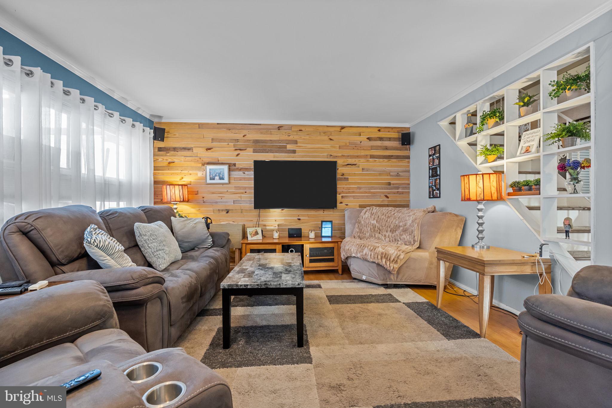 55 Rose Apple Road Levittown, PA 19056 - Photo 7 of 40 a living room with furniture and a flat screen tv