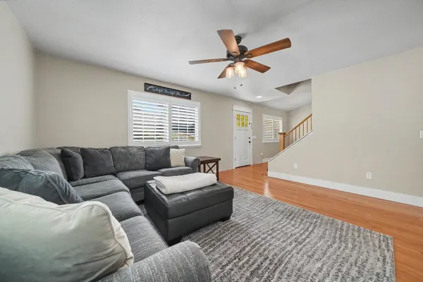 a living room with furniture and a large window
