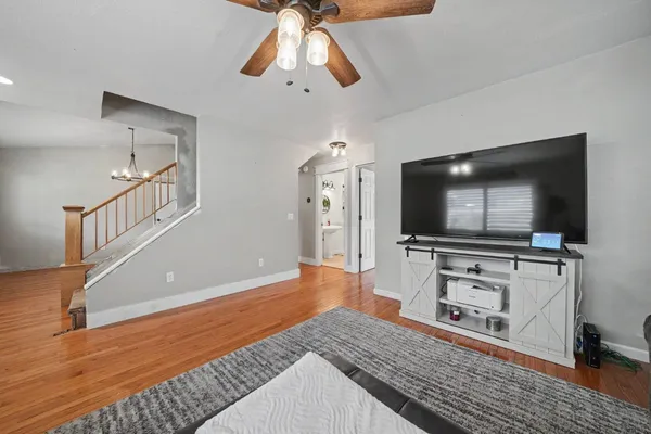 a living room with furniture and a flat screen tv