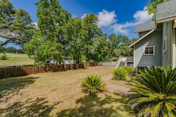 a swimming pool with wooden fence