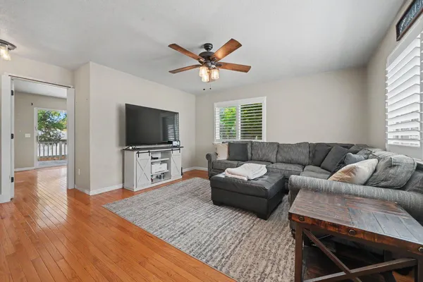 a living room with furniture and a flat screen tv
