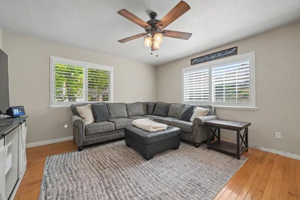 a living room with furniture and a window