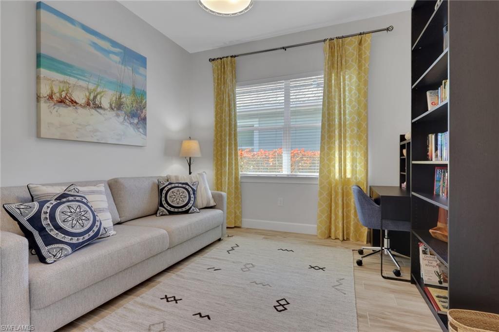 6394 Warwick Avenue Naples, FL 34113 - Photo 20 of 30 a living room with furniture and a window