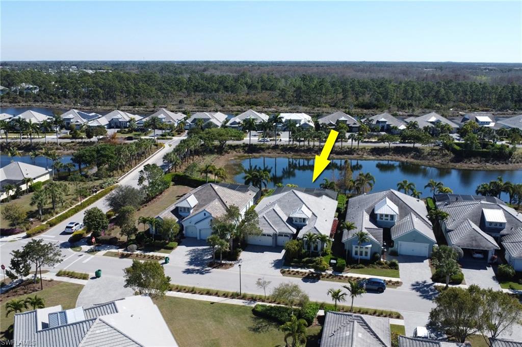 6394 Warwick Avenue Naples, FL 34113 - Photo 23 of 30 an aerial view of a house with a swimming pool yard and outdoor seating
