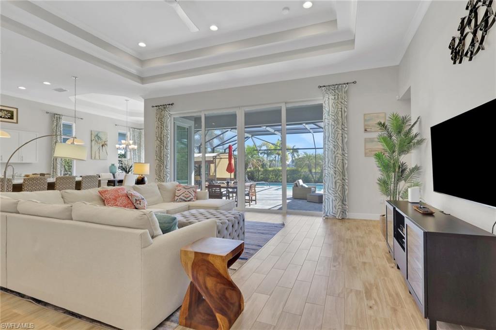 6394 Warwick Avenue Naples, FL 34113 - Photo 3 of 30 a living room with furniture and a flat screen tv