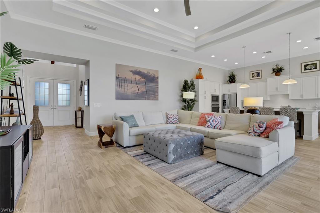 6394 Warwick Avenue Naples, FL 34113 - Photo 4 of 30 a living room with furniture and a couch