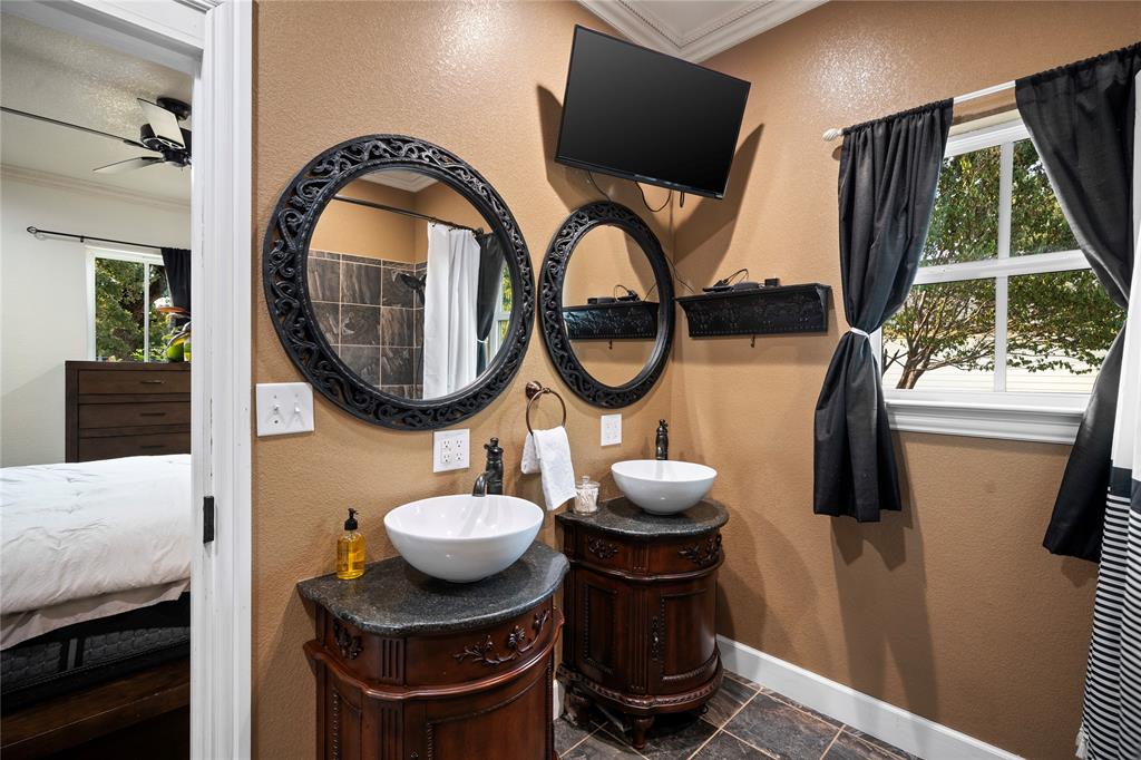 202 North Kickapoo Street Lipan, TX 76462 - Photo 20 of 38 Dual vessel sinks with individual wood-finish vanities