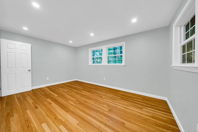 a view of empty room with windows