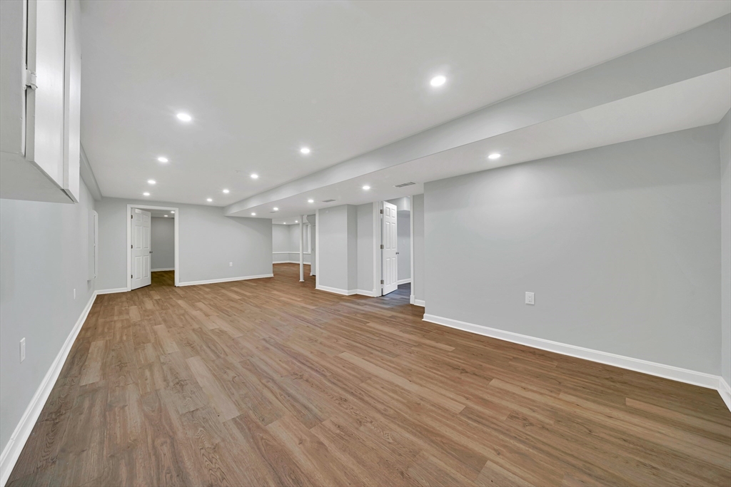 11 Gould Road Andover, MA 01810 - Photo 19 of 31 an empty room with wooden floor
